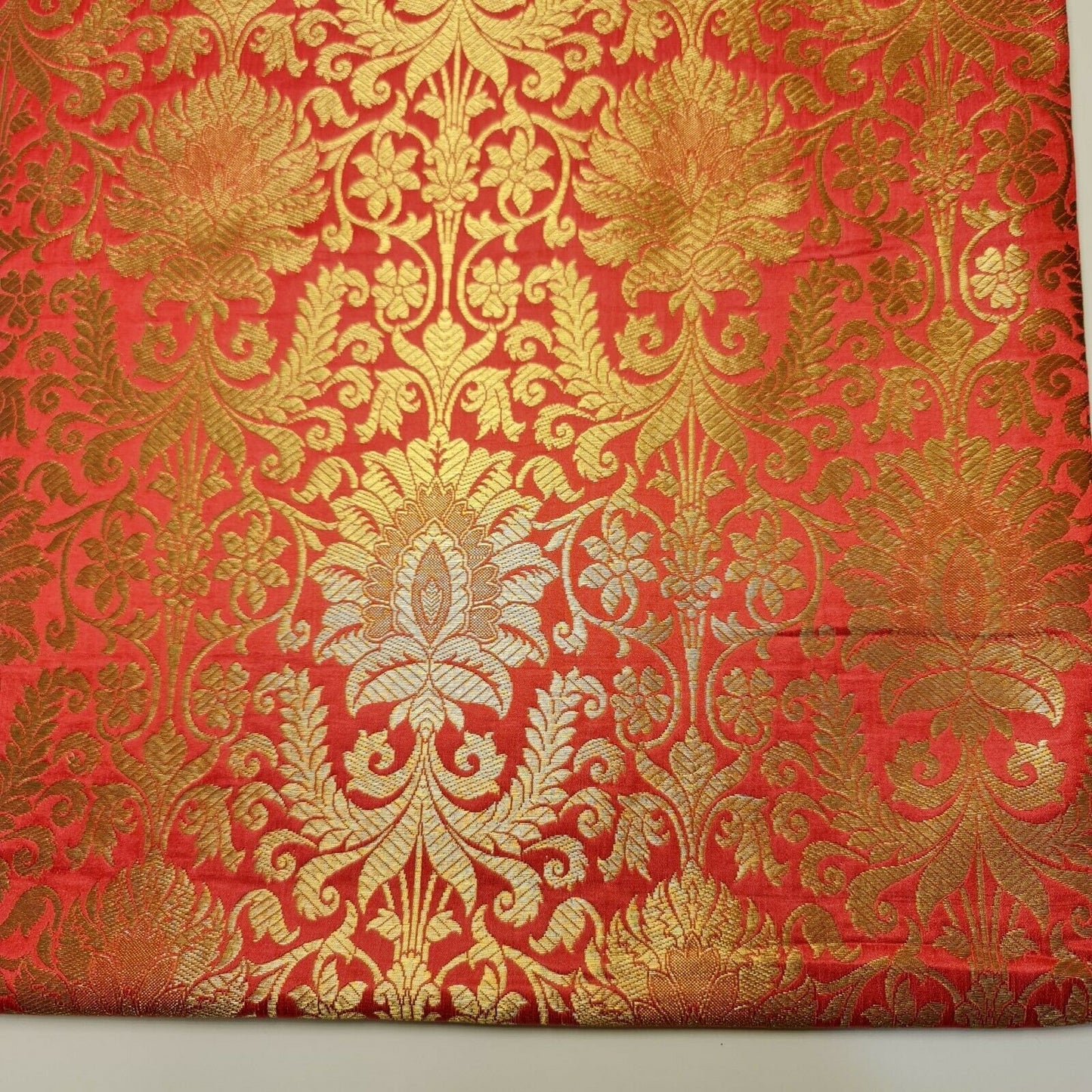 coral pink brocade fabric with gold metallic print