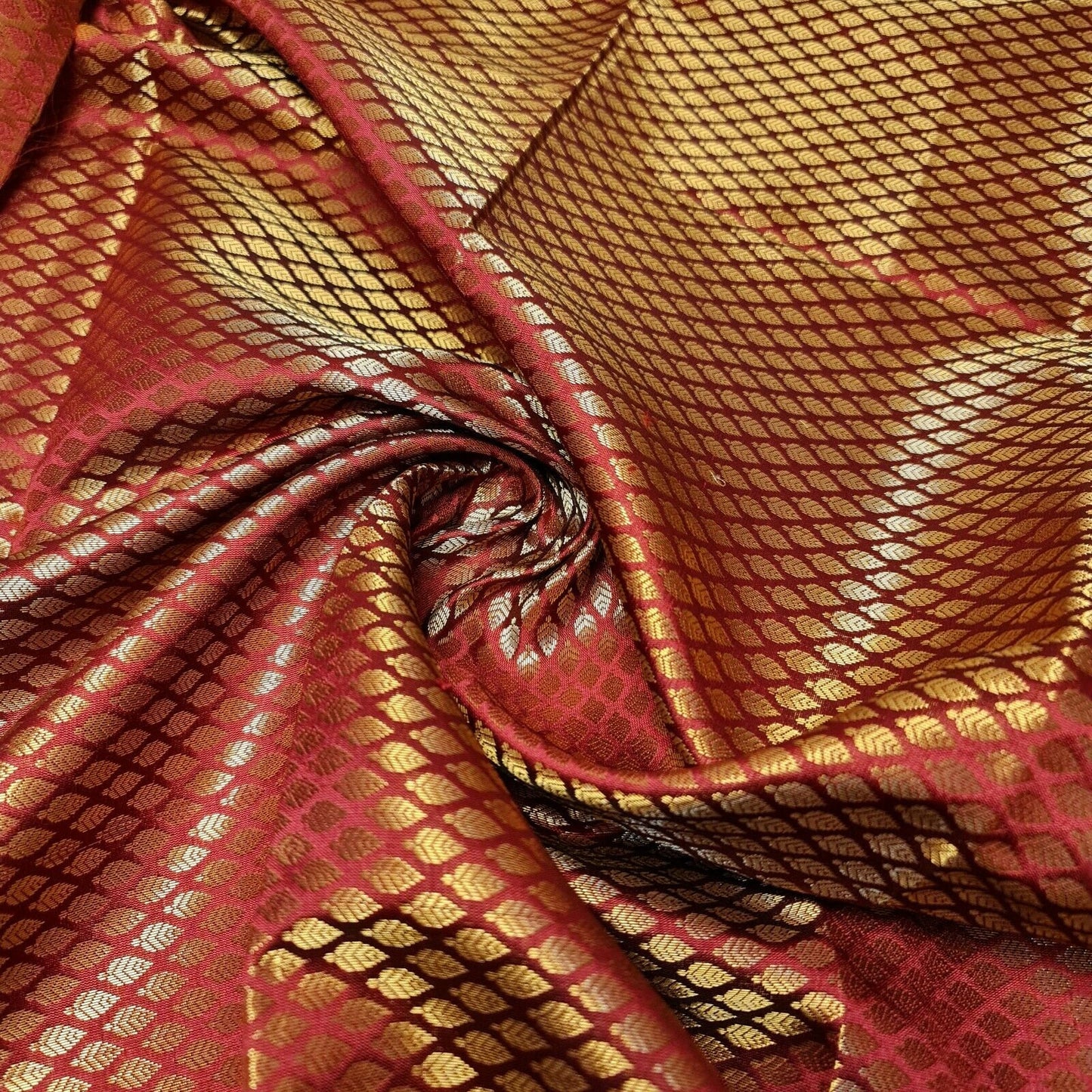 deep red brocade fabric with metallic gold leaf print