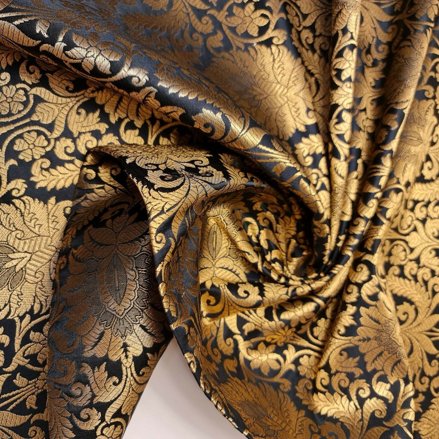 gold and black damask brocade fabric with floral gold leaf metallic design sold by meter online in uk