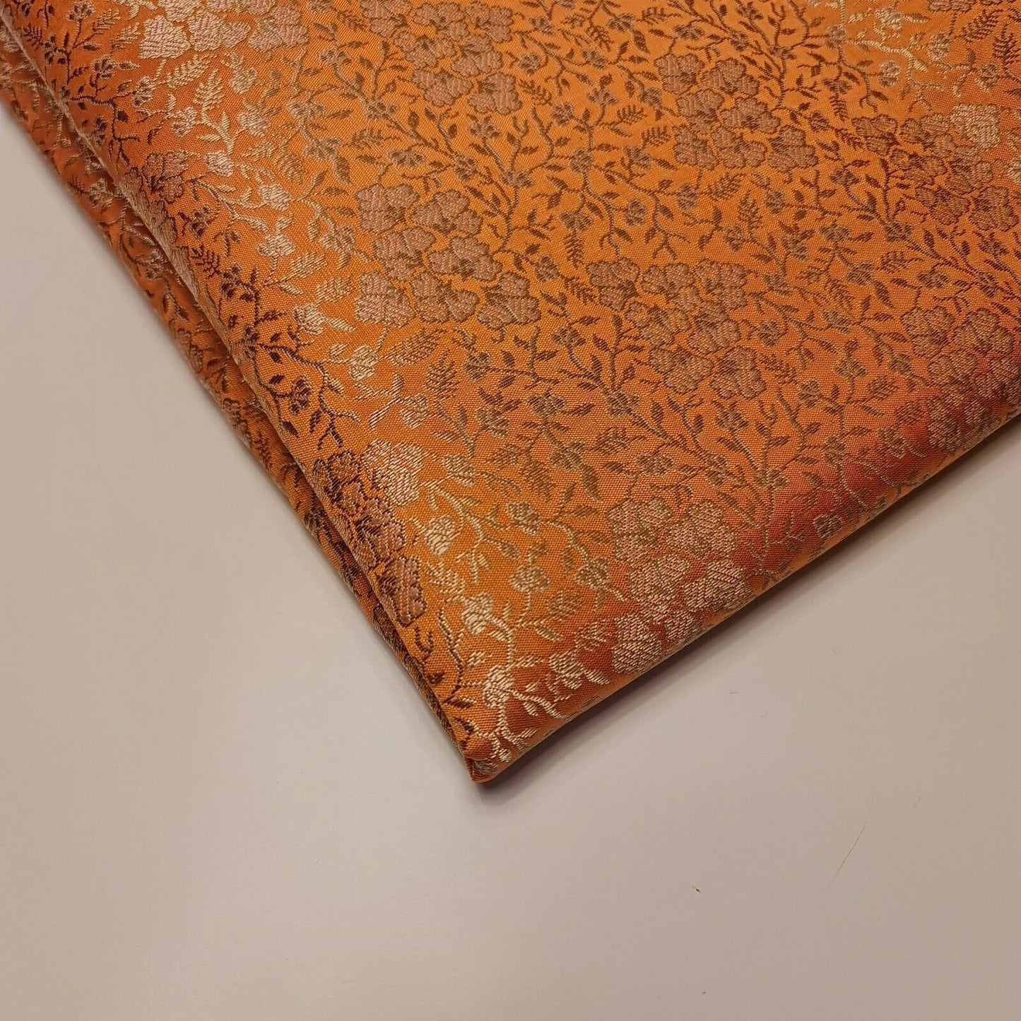peach brocade fabric with floral gold metallic print