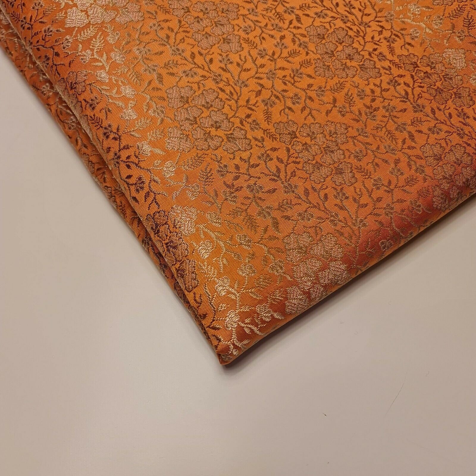 peach brocade fabric with floral gold metallic print