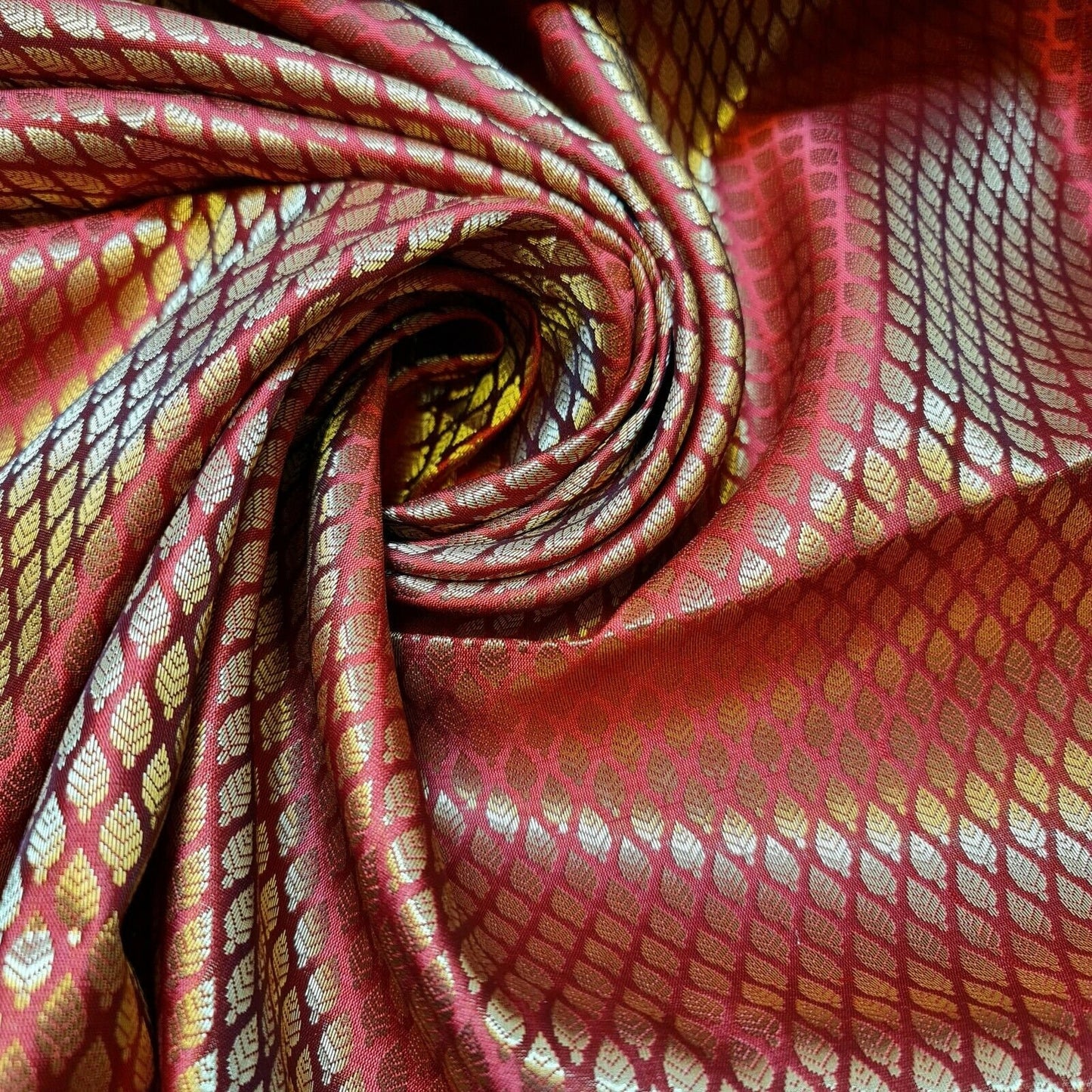 red brocade fabric with metallic gold leaf print