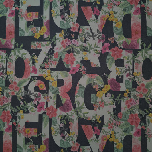Floral patterned fabric with letters on a black background