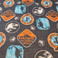 Dinosaur Cotton Jersey Fabric – “Evacuate Isla Nublar” Baby Grow Material (Soft Stretch, 58” Wide) By the Meter