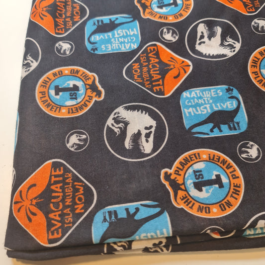Dinosaur Cotton Jersey Fabric – “Evacuate Isla Nublar” Baby Grow Material (Soft Stretch, 58” Wide) By the Meter