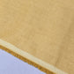 Camel 100% Cotton Chambray fabric draped to display its soft lightweight woven texture, 58-inch wide dressmaking fabric sold by the metre.