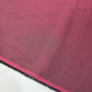 Burgundy 100% cotton chambray fabric draped to showcase its soft lightweight woven texture, 58-inch wide dressmaking fabric sold by the metre.