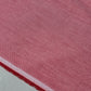 Dusty Rose 100% cotton chambray fabric draped to showcase its soft lightweight woven texture, 58-inch wide dressmaking fabric sold by the metre.