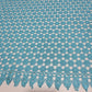 Turquoise mesh lace fabric with scalloped border
