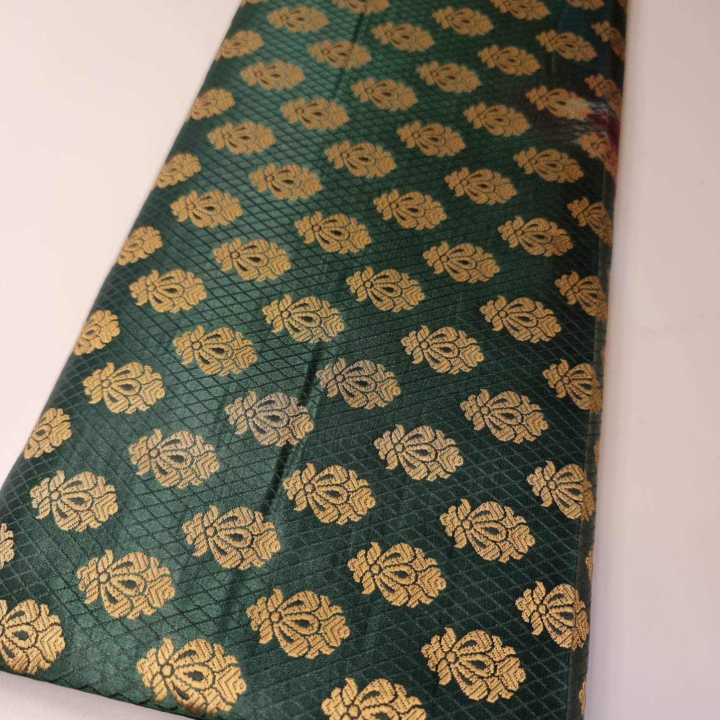 bottle green brocade fabric with gold floral design
