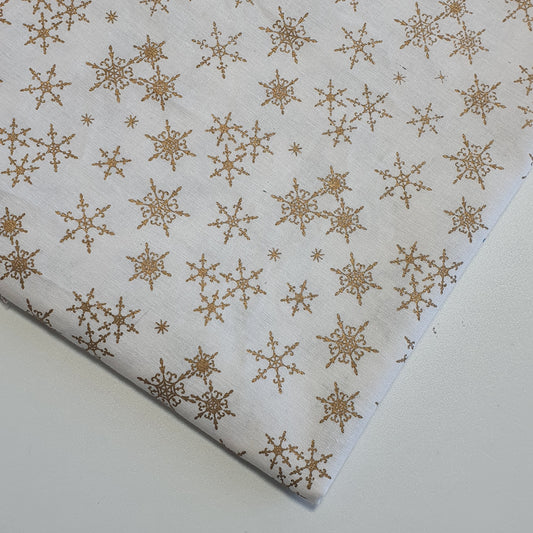 ivory xmas cotton fabric with gold snowflakes print