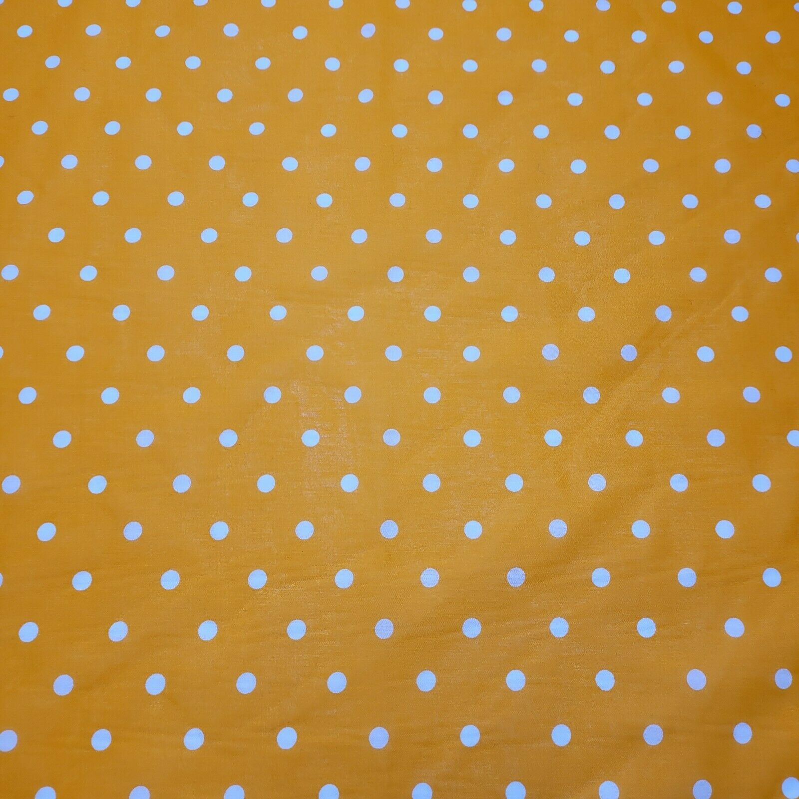 orange spotty polka dot polycotton material