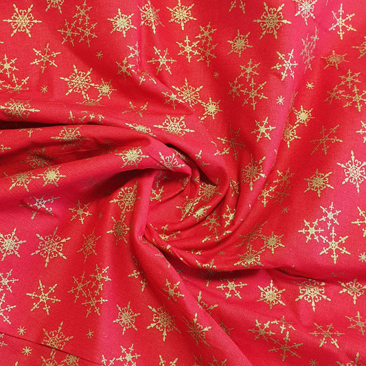 red christmas fabric with snowlflakes gold print for sewing projects uk