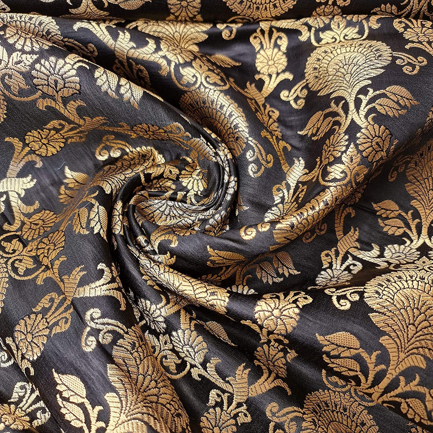 black brocade fabric with floral motifs