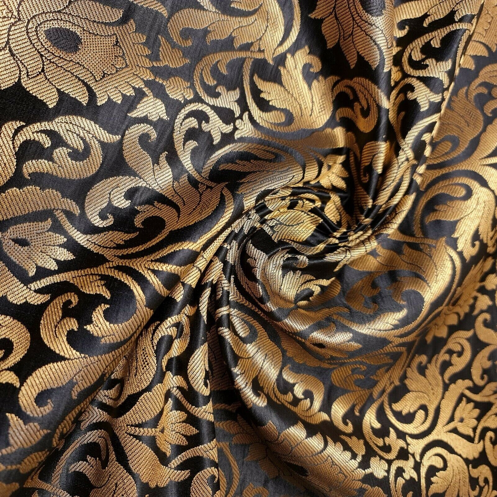black brocade fabric with tulip gold metallic pattern for dressmaking, crafting, and decor