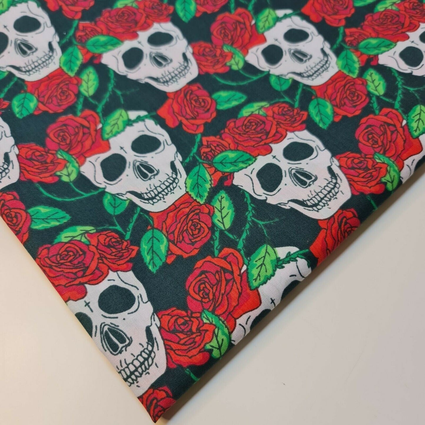 black halloween fabric material with skulls and roses printed