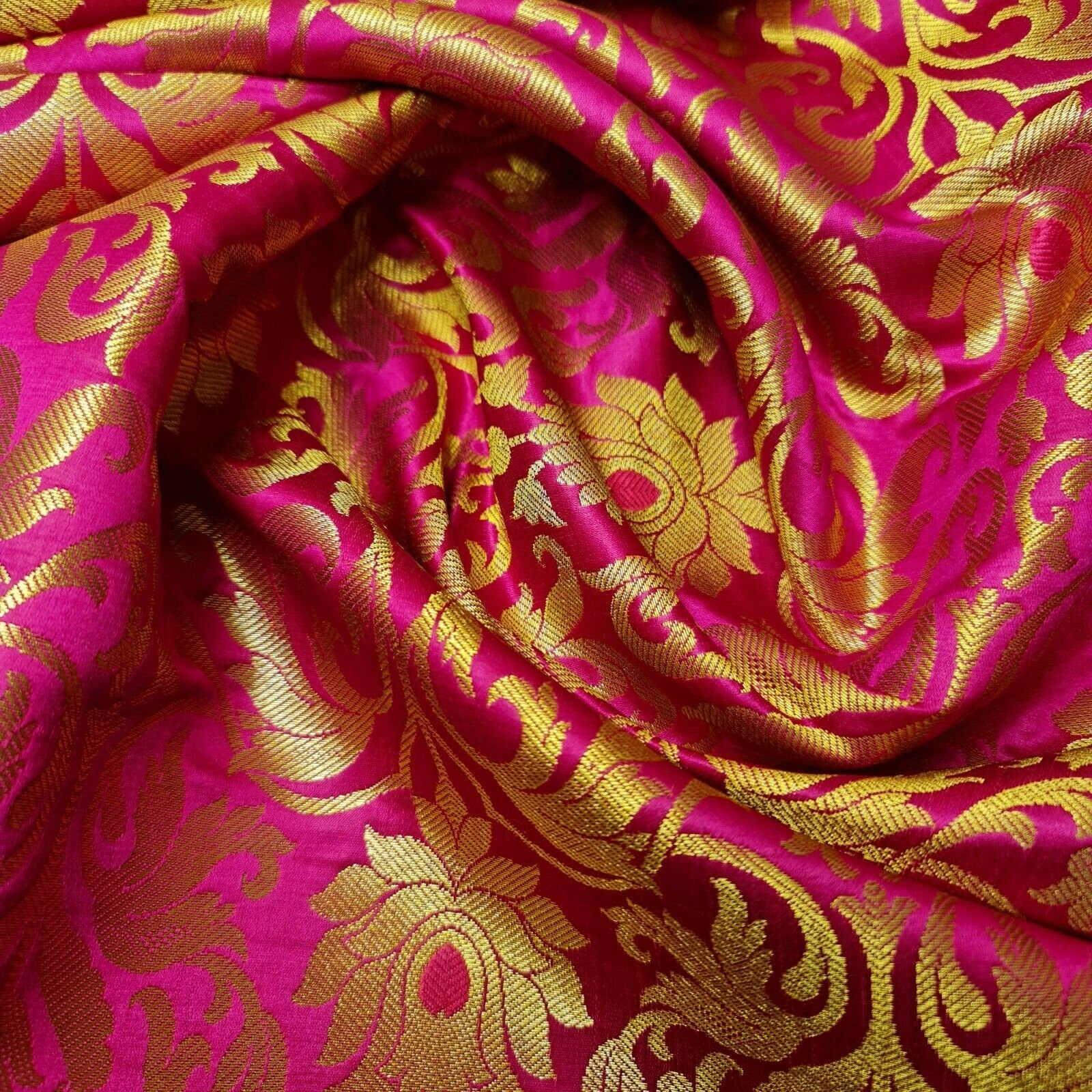 cerise pink brocade fabric with tulip gold metallic pattern for dressmaking, crafting, and decor