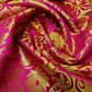 cerise pink brocade fabric with tulip gold metallic pattern for dressmaking, crafting, and decor