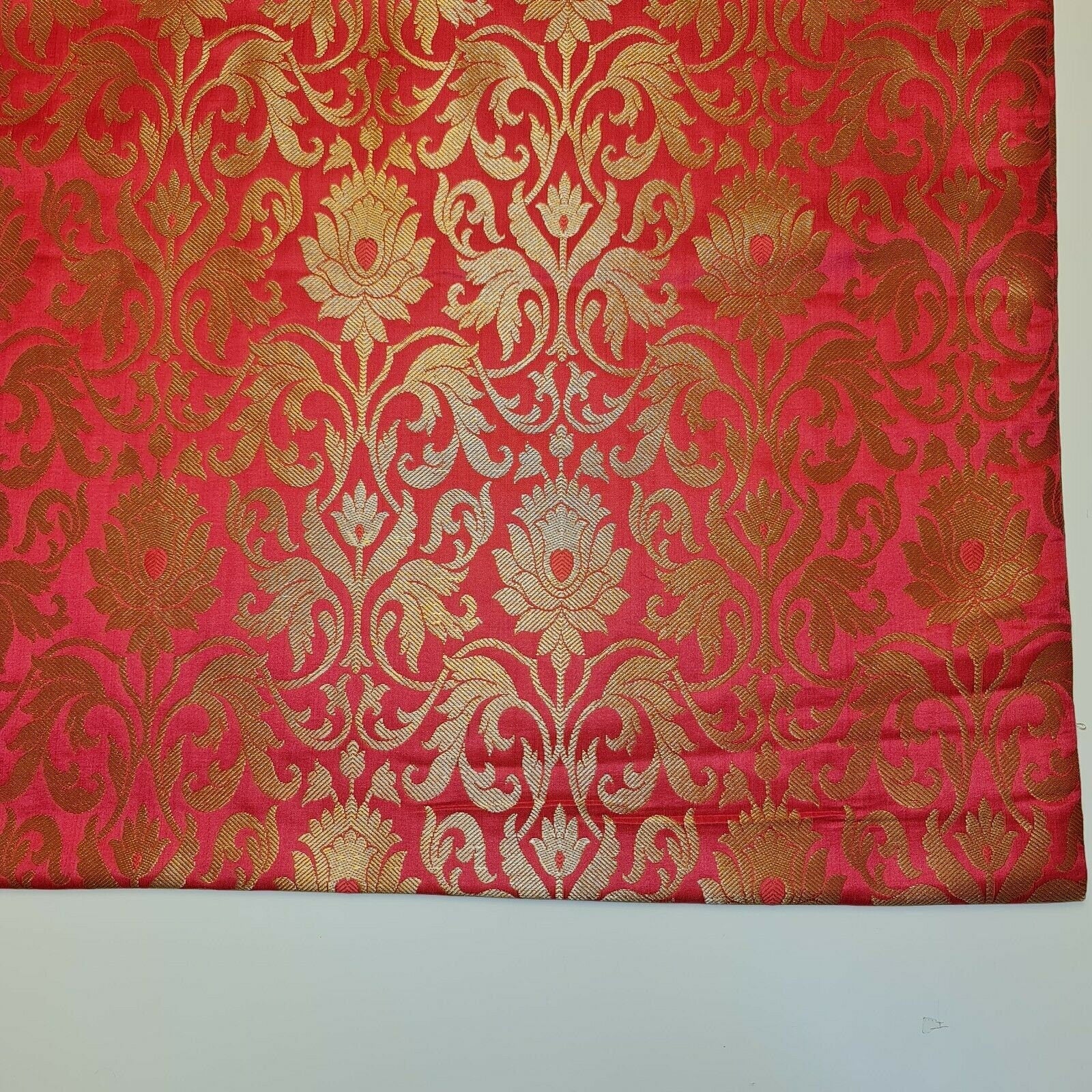 coral pink brocade textile for dressmaking and decor