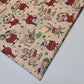 cream christmas fabric by the metre with santa and reindeer print