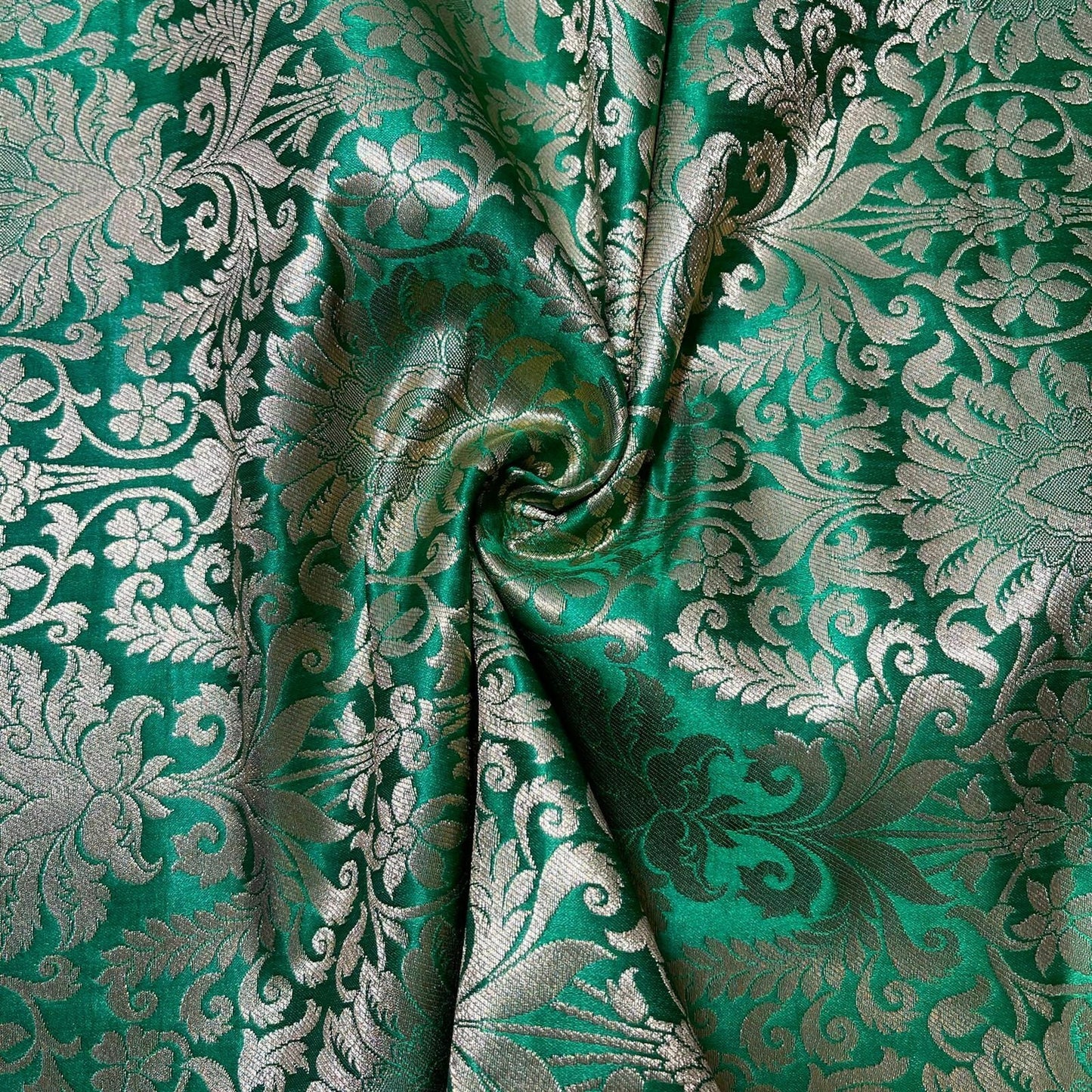 emerald green silk brocade fabric for dressmaking and crafting