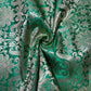 emerald green silk brocade fabric for dressmaking and crafting