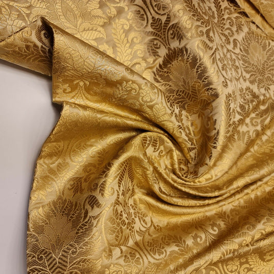 gold brocade fabric with floral design