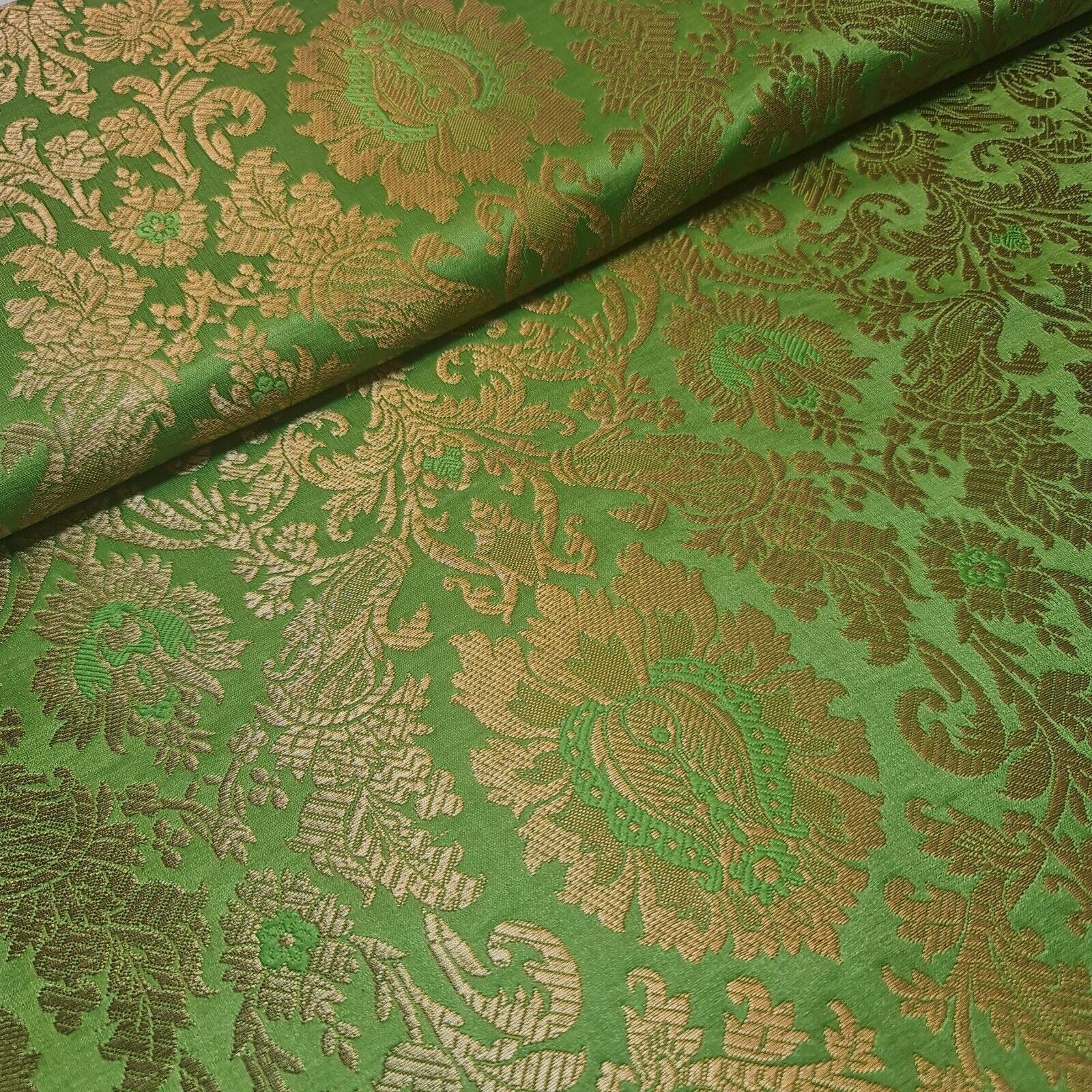 green brocade material with floral print