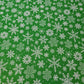 green christmas fabric with snowflakes print for craft and decor