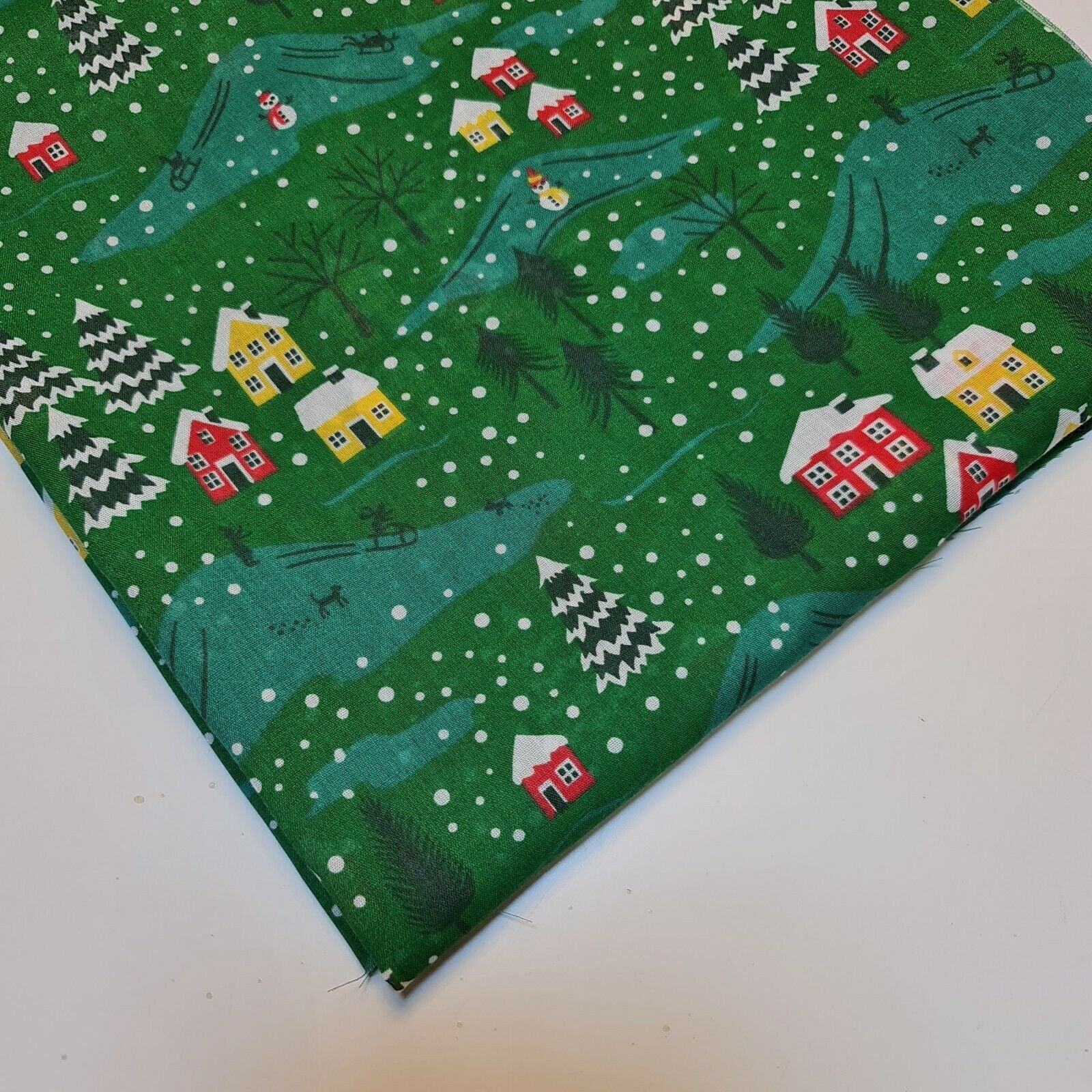 green christmas material with christmas festive print