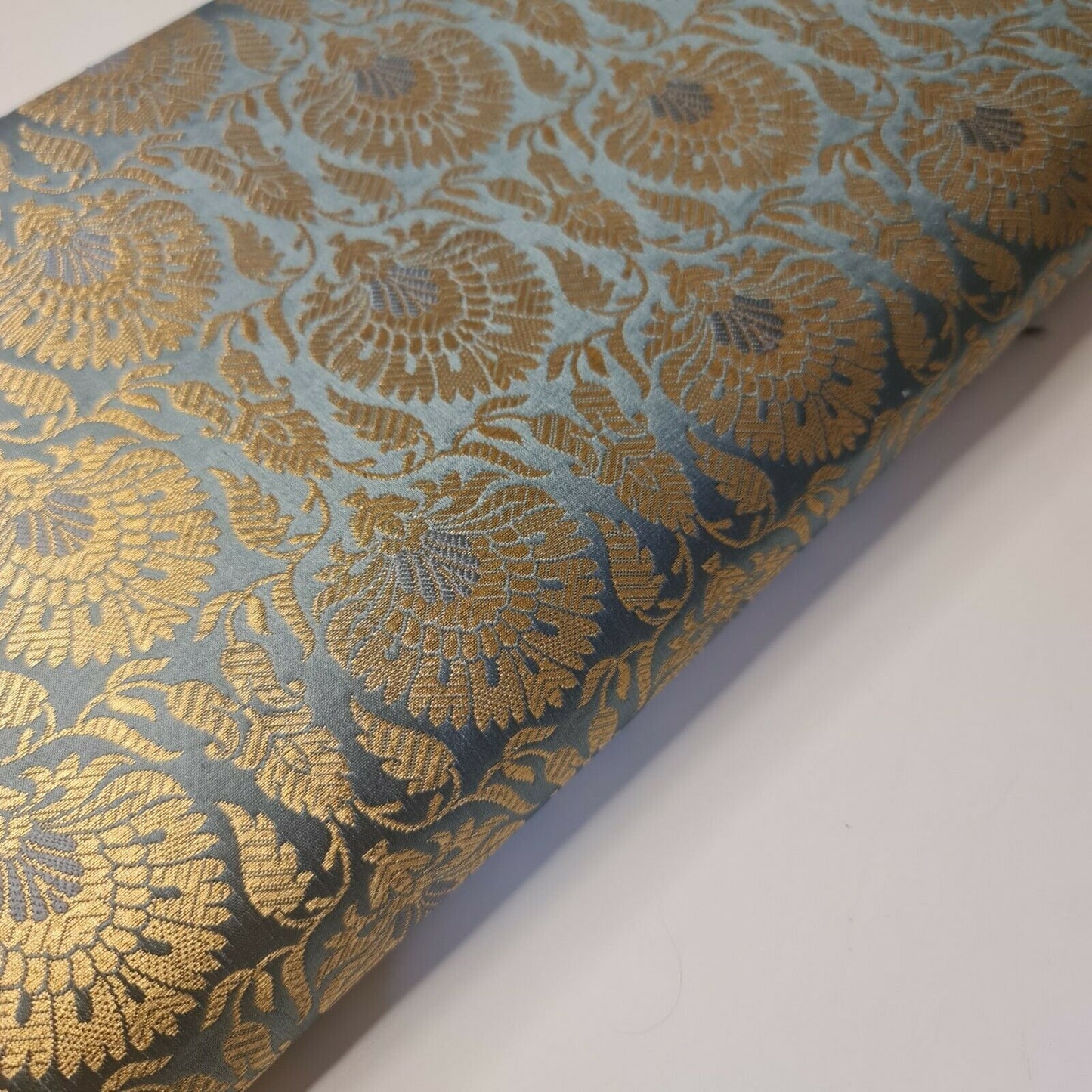 grey brocade material with floral print
