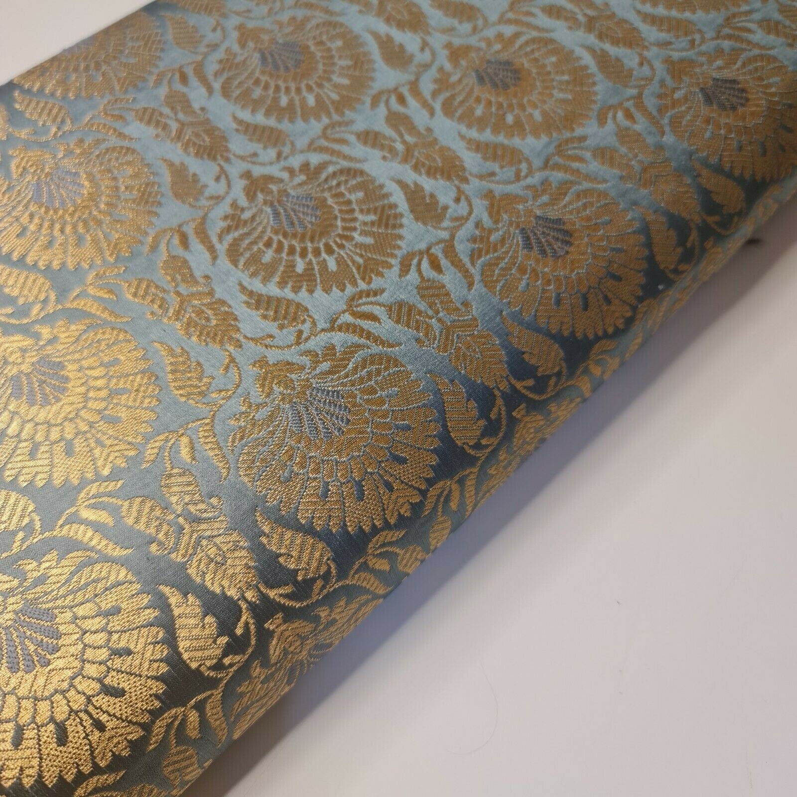 grey brocade material with floral print