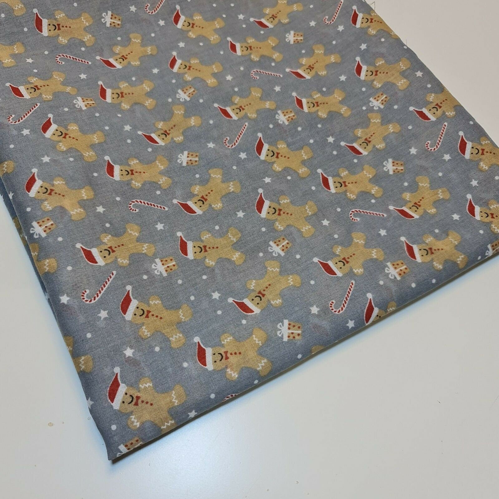 grey christmas fabric with ginger man print