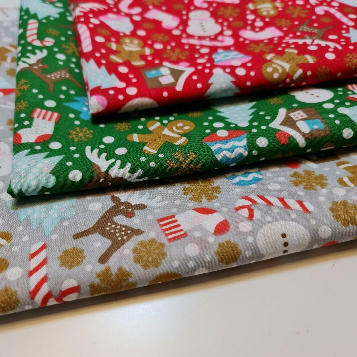 grey green and red christmas fabric by the metre with ginger mane print