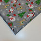 grey xmas polycotton material with santa, snowman, reindeer, and tree print