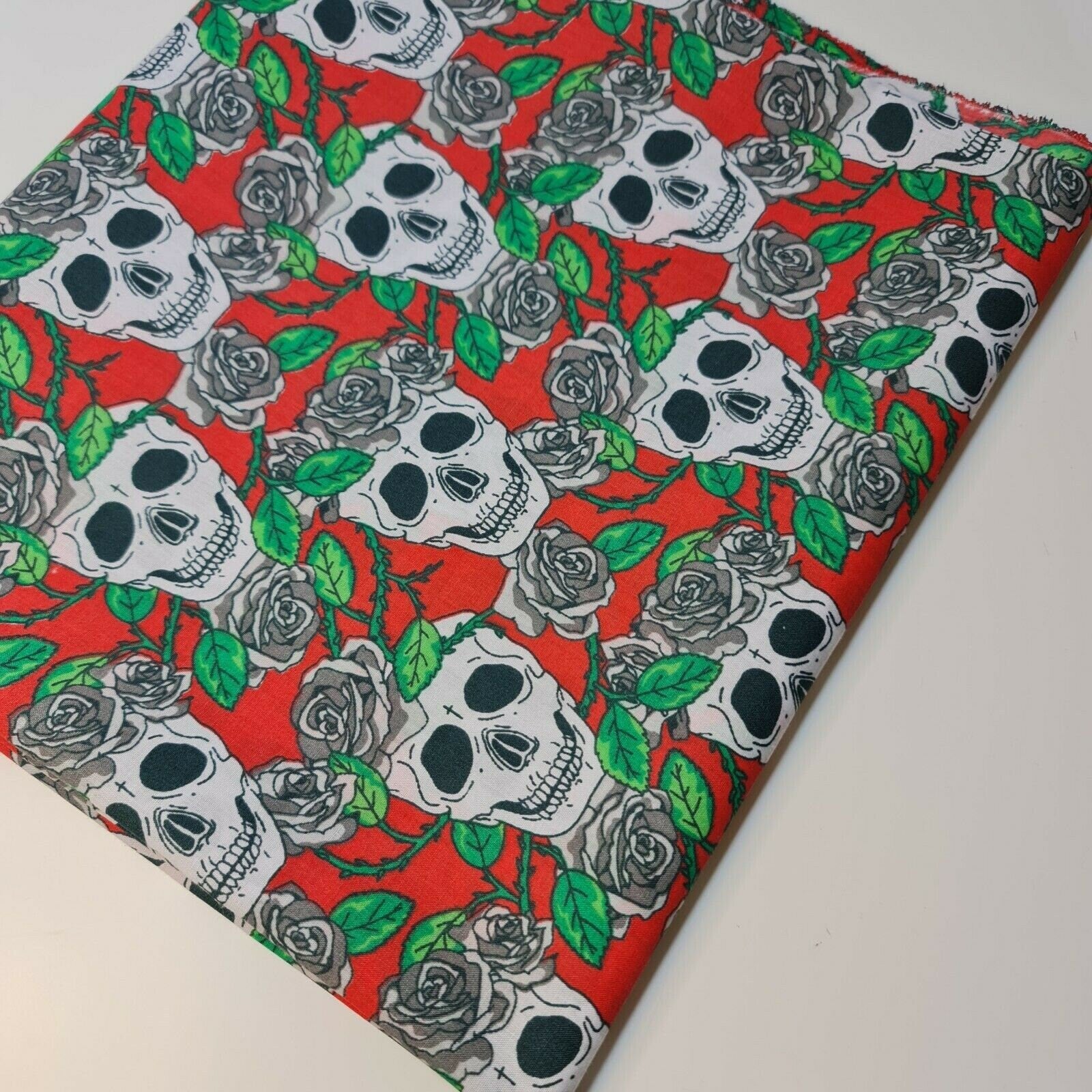 halloween material fabric with haunted skull and roses design