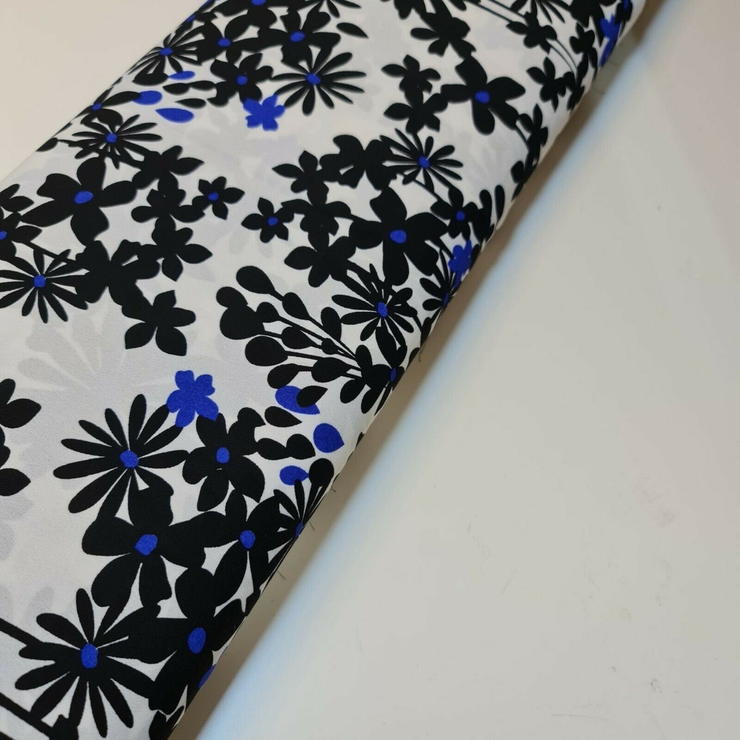 Printed Crepe Fabric White Base Black Flowers Neon Blue Spot Dress (58" wide)