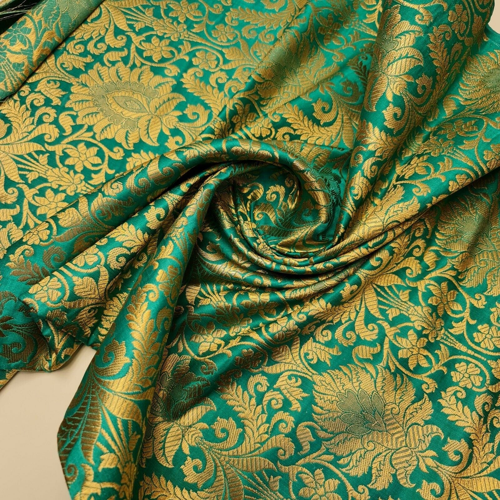 jade green brocade fabric for dressmaking and crafting