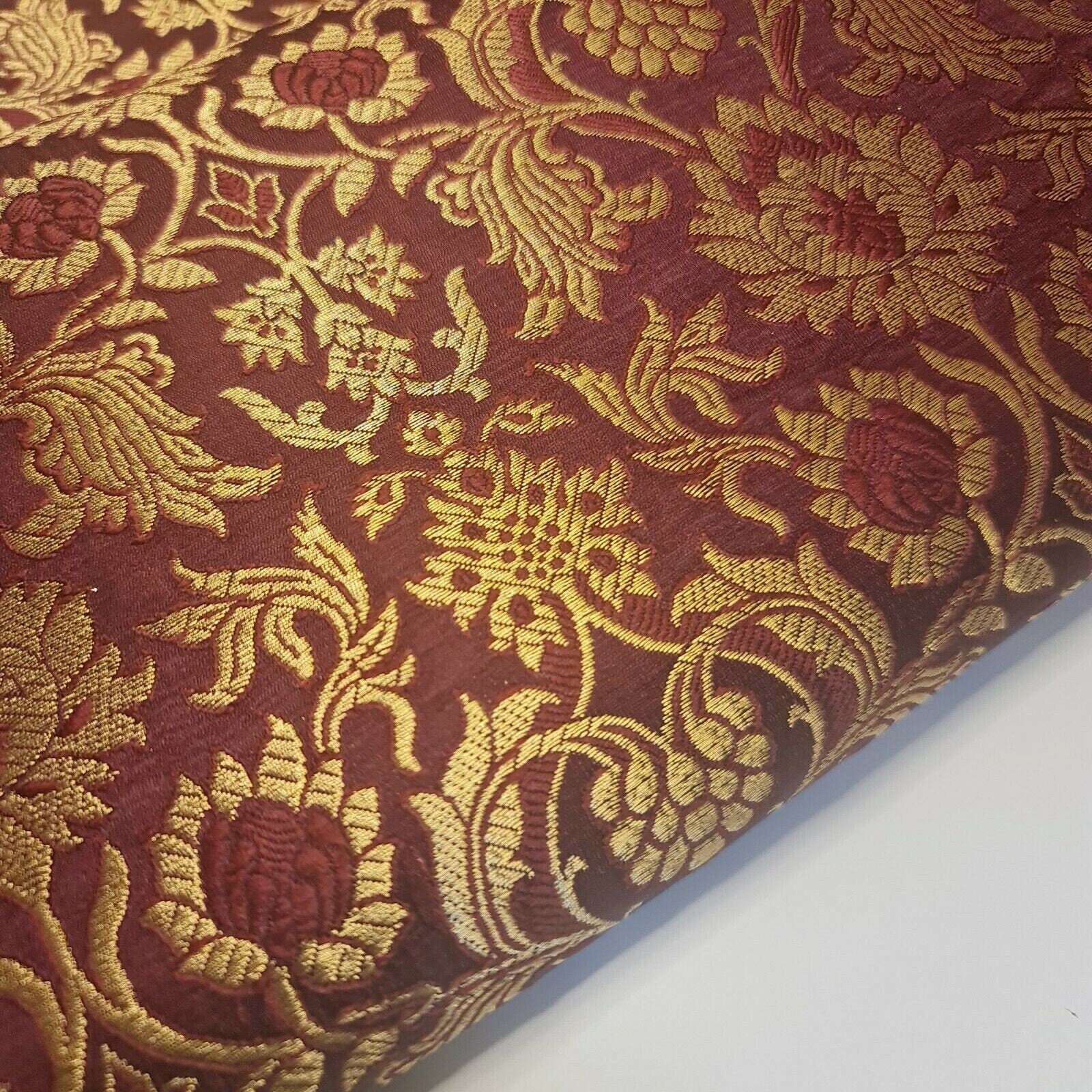 maroon brocade material with floral print