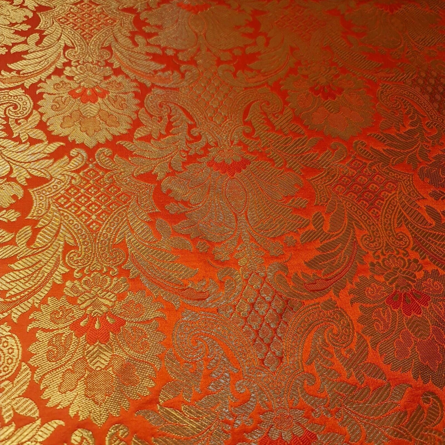 orange brocade material fabric with gold metallic floral print