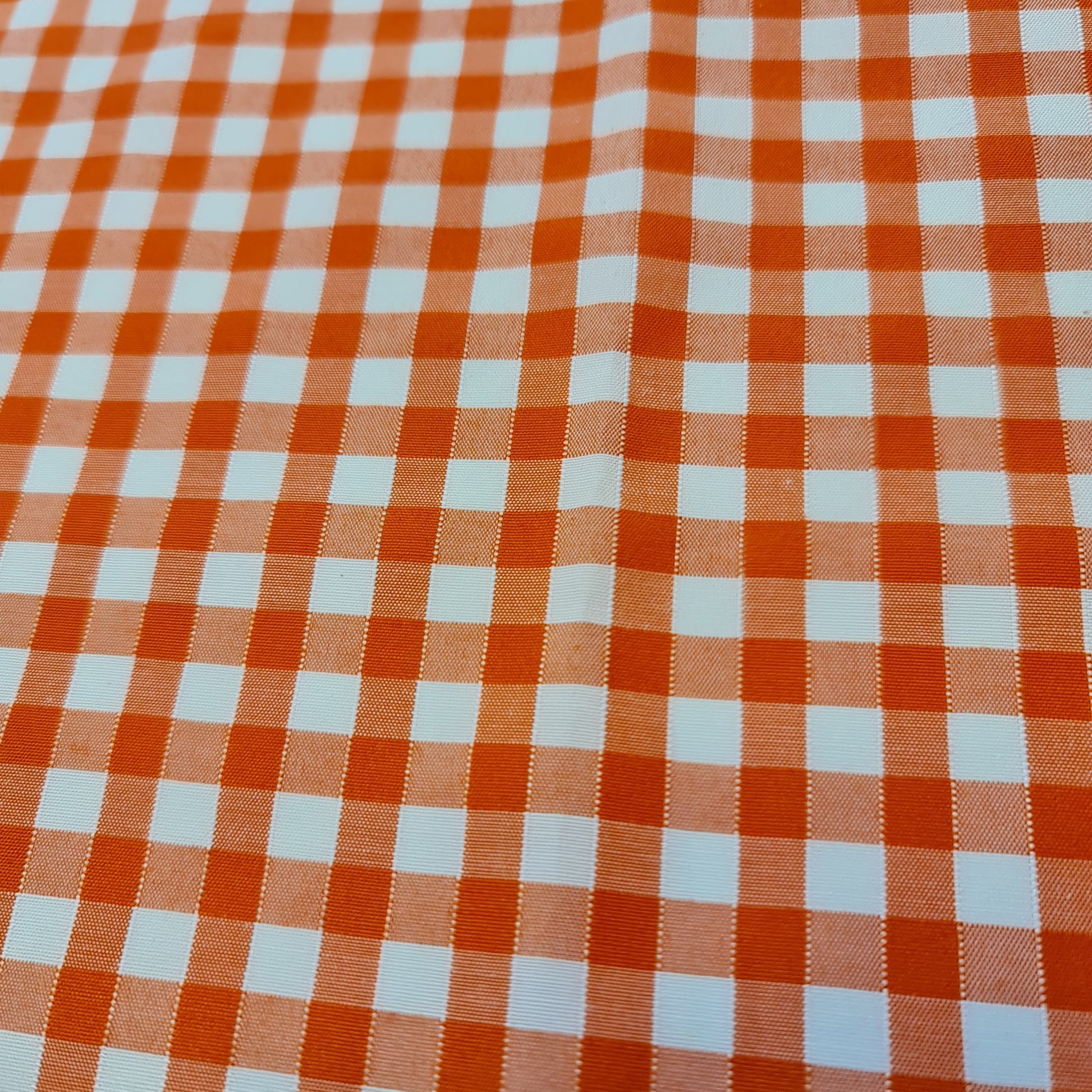 orange polycotton gingham material with check pattern for dressmaking