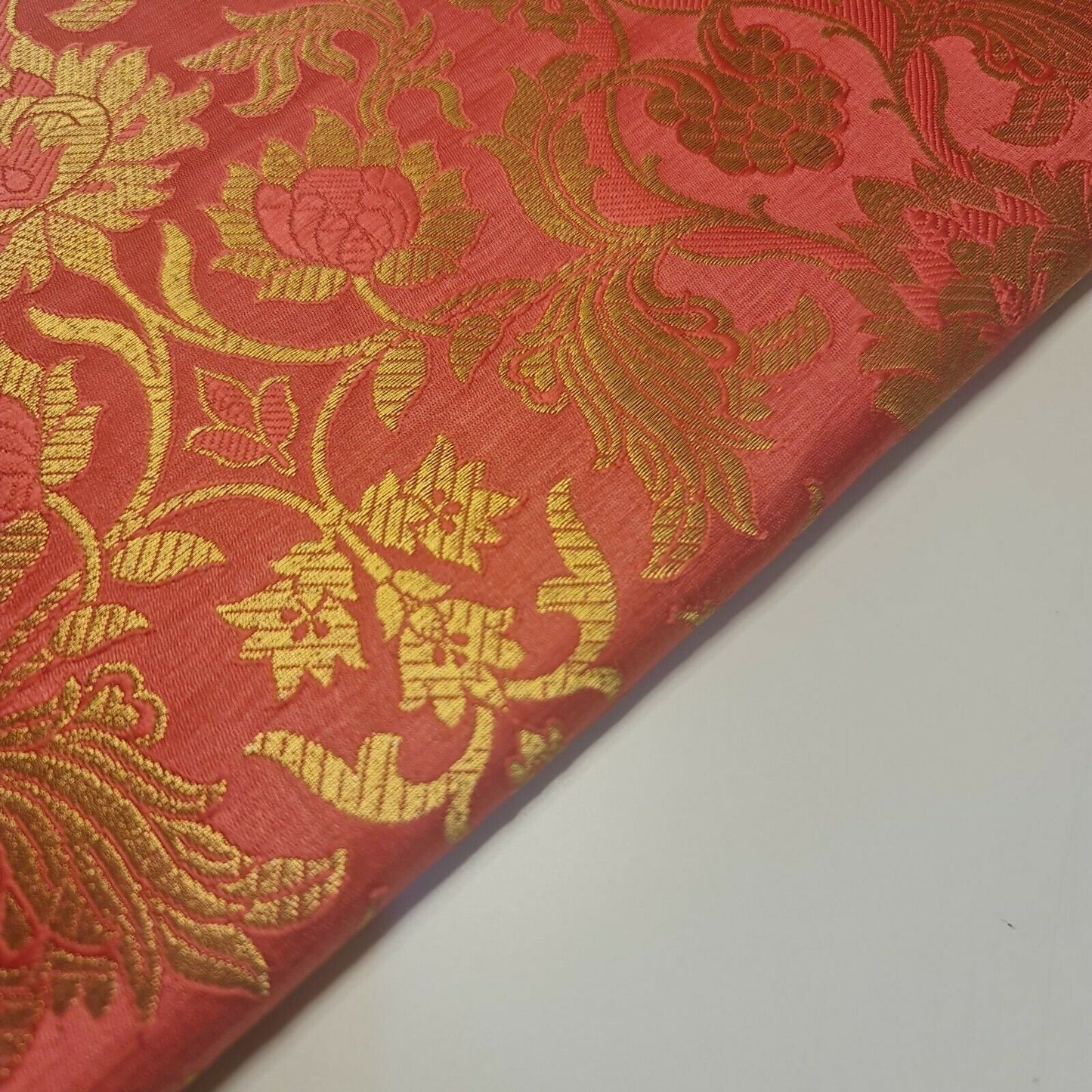 peach brocade material with floral print