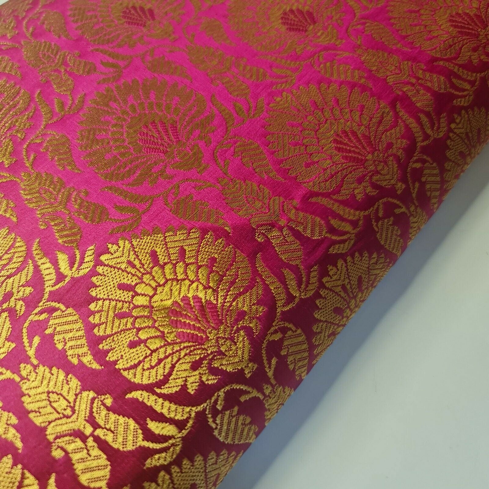 pink brocade material with floral-print