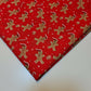 red christmas fabric with ginger man print