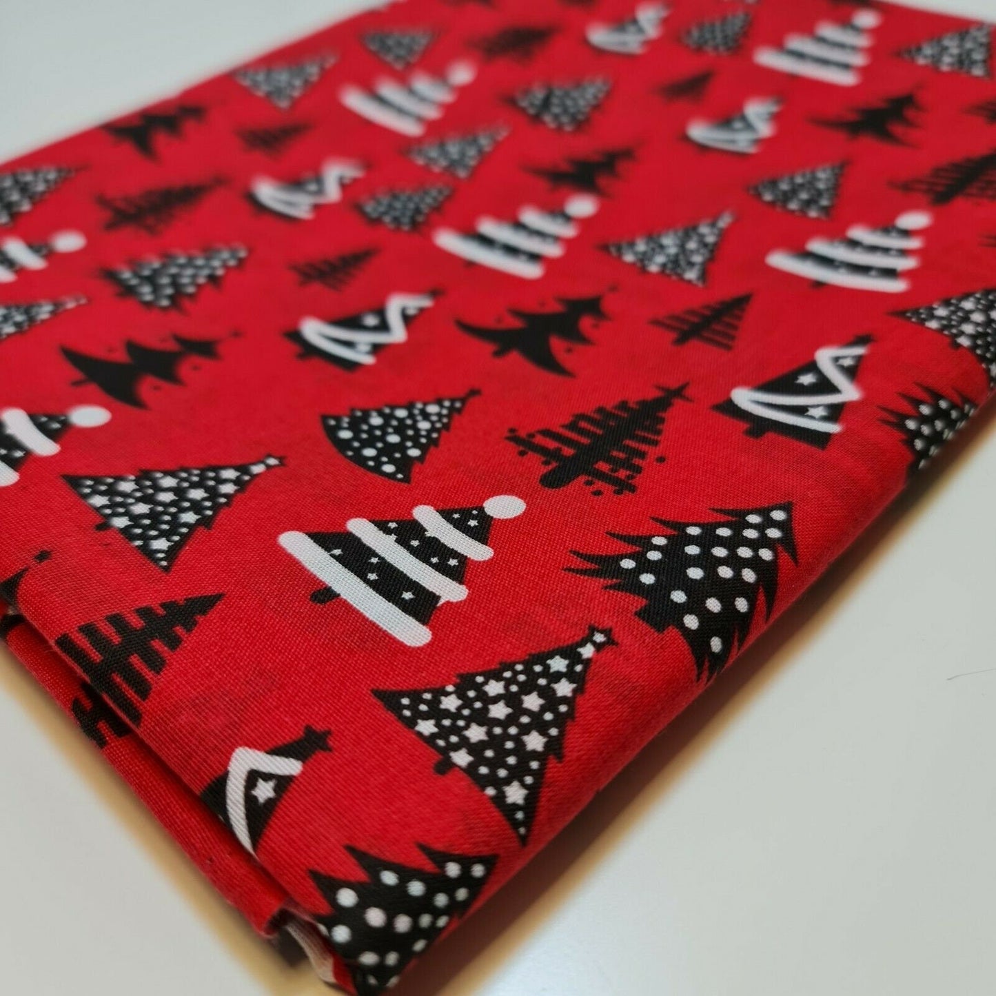 red christmas festive polycotton fabric with xmas tree design