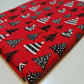 red christmas festive polycotton fabric with xmas tree design