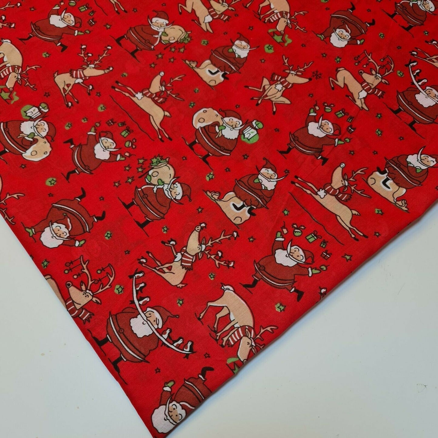 red christmas polycotton fabric uk wth santa and reindeer print