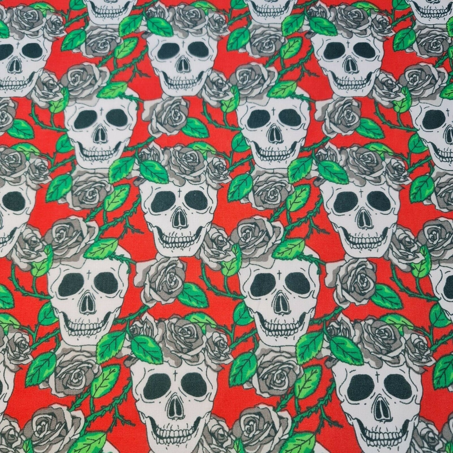 red polycotton fabric with skulls and roses print
