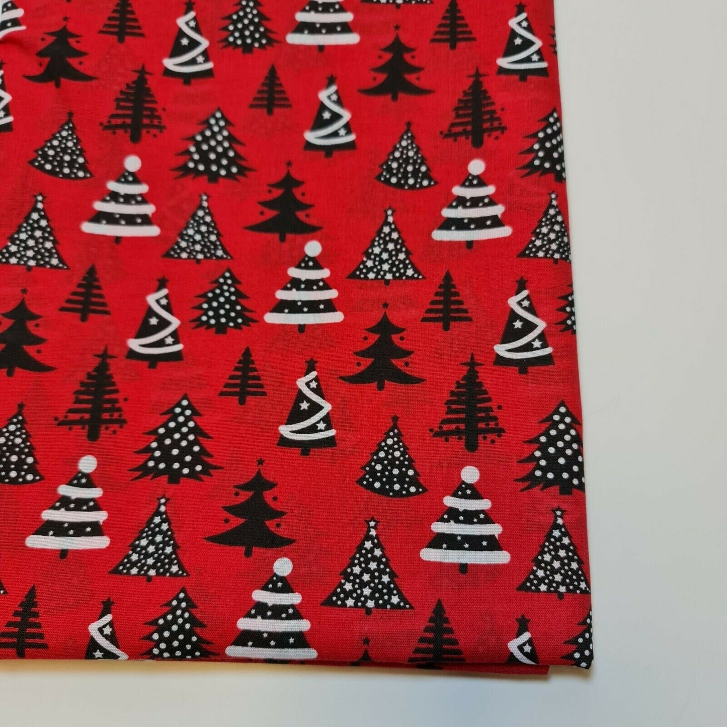 red xmas polycotton fabric with xmas tree print