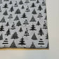 silver xmas material with tree print for dressmaking and crafting